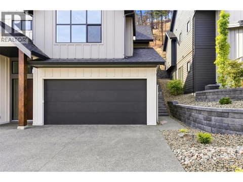 Attached Double-Car Garage | Lower Level - With 10ft ceilings & epoxy floorings at 1448 Whistling Pine Place, Wilden, Kelowna