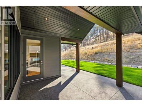 Covered Patio & Backyard Space | Upper Level - Roughed in for a hot tub at 1448 Whistling Pine Place, Wilden, Kelowna