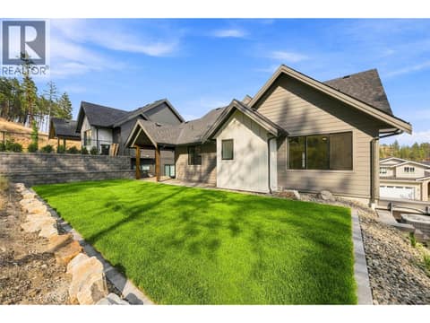Covered Patio & Backyard Space | Upper Level - Roughed in for a hot tub at 1448 Whistling Pine Place, Wilden, Kelowna