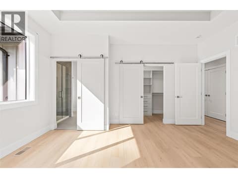 Primary Bedroom | Upper Level - Bedroom #1 - with 4 piece ensuite & walk-in closet at 1448 Whistling Pine Place, Wilden, Kelowna