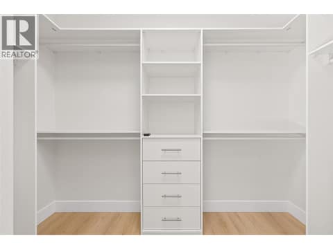 Primary Walk-In Closet | Upper Level at 1448 Whistling Pine Place, Wilden, Kelowna