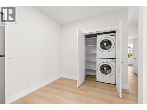 Separate Suite Laundry | Lower Level at 1448 Whistling Pine Place, Wilden, Kelowna