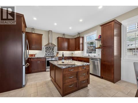 Custom Kitchen With Granite Countertops, Norelco Cabinetry & Induction Cooking at 2478 Stone Grove Crescent, Shannon Lake, West Kelowna