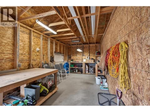 Dedicated Workshop Space At The Rear Of The Garage Perfect For Projects And Storage at 2478 Stone Grove Crescent, Shannon Lake, West Kelowna