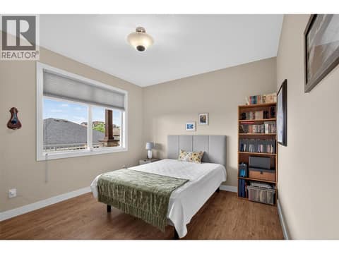 Main Floor Bedroom — Perfect as a Guest Room or Home Office at 2478 Stone Grove Crescent, Shannon Lake, West Kelowna
