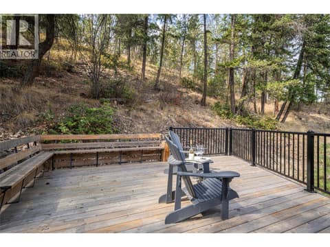 Upper Deck sitting surrounded by trees and spectacular mountain views! at 670 Cassiar Road, Dilworth Mountain, Kelowna