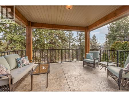 Main home covered patio (stamped concrete) at 12633 Driftwood Court, Lake Country North West