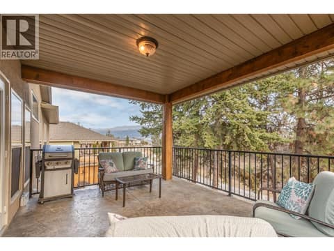 Main home covered patio (stamped concrete) at 12633 Driftwood Court, Lake Country North West