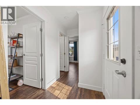 A bright hallway connects the bedrooms and living spaces. at 9020 Jim Bailey Road Unit# 174, Lake Country East / Oyama, Kelowna