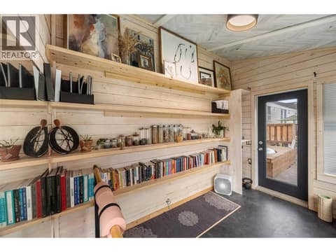 A charming detached studio with beautiful wood detailing and built-in shelving, offering flexible space for yoga, fitness, hobbies, art or a quiet creative retreat. at 9020 Jim Bailey Road Unit# 174, Lake Country East / Oyama, Kelowna