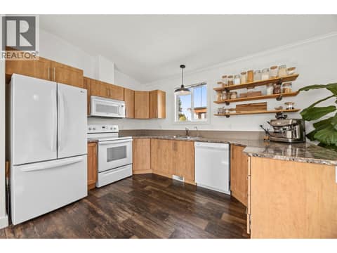A generous U-shaped layout provides excellent workspace and storage. at 9020 Jim Bailey Road Unit# 174, Lake Country East / Oyama, Kelowna