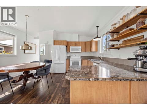 Ample prep space with a peninsula overlooking the dining area. at 9020 Jim Bailey Road Unit# 174, Lake Country East / Oyama, Kelowna