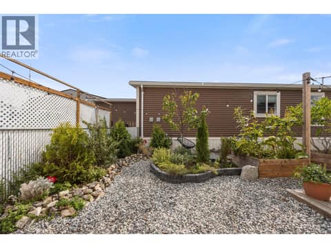 Beautifully established gardens create a lush, peaceful outdoor setting with plenty of personality. at 9020 Jim Bailey Road Unit# 174, Lake Country East / Oyama, Kelowna