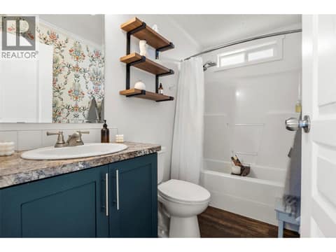 Bright main bathroom with a full tub/shower and stylish updated details. at 9020 Jim Bailey Road Unit# 174, Lake Country East / Oyama, Kelowna