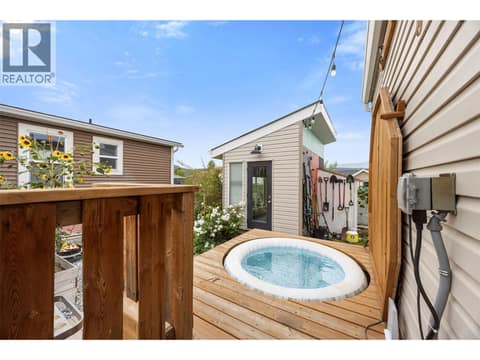 Built-in Softub creates a private spot to relax, with the mechanical lift deck lid making access quick and easy. at 9020 Jim Bailey Road Unit# 174, Lake Country East / Oyama, Kelowna