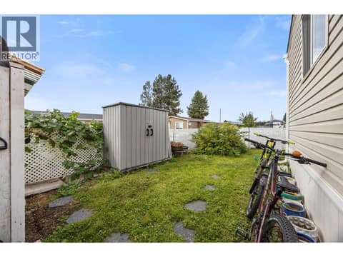 The fully fenced side yard offers even more usable outdoor space, complete with a separate storage shed. at 9020 Jim Bailey Road Unit# 174, Lake Country East / Oyama, Kelowna