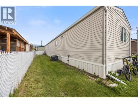 The fully fenced side yard offers even more usable outdoor space, complete with a separate storage shed. at 9020 Jim Bailey Road Unit# 174, Lake Country East / Oyama, Kelowna