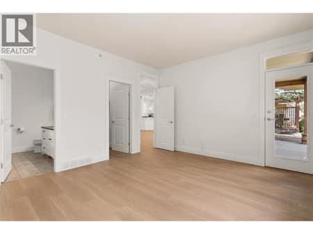 Primary Bedroom with access to the covered patio at 153 Mashie Crescent, Predator Ridge, Vernon