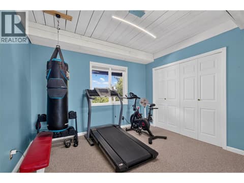 Downstairs 2nd Bedroom currently being used as a gym at 1863 Horizon Drive, West Kelowna Estates