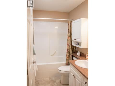 Main floor 4 pce. bathroom with Sun Tunnel at 1985 Stikine Place, Juniper Ridge, Kamloops
