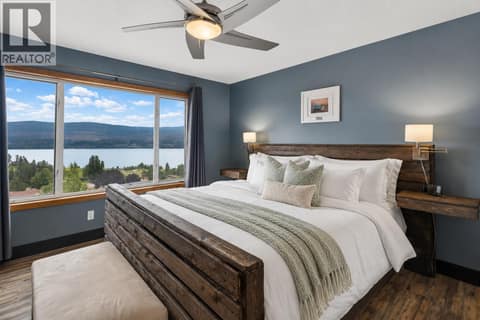 Primary bedroom with lake views and ensuite at 1108 Menu Road, Lakeview Heights, West Kelowna