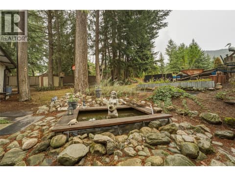 Backyard with pond and mature trees at 3304 Sidney Crescent, Armstrong/ Spall., Spallumcheen