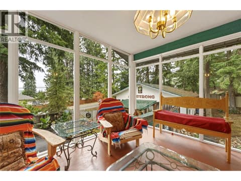 Main home - Enclosed sunroom overlooking carriage house in background at 3304 Sidney Crescent, Armstrong/ Spall., Spallumcheen