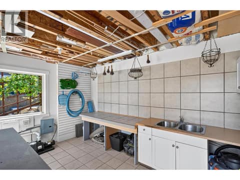 Dedicated potting room with sink, workspace and ample storage. at 471 Long Ridge Drive, Wilden, Kelowna