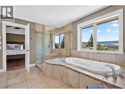 Soaker tub, glass shower and sweeping valley views. at 471 Long Ridge Drive, Wilden, Kelowna