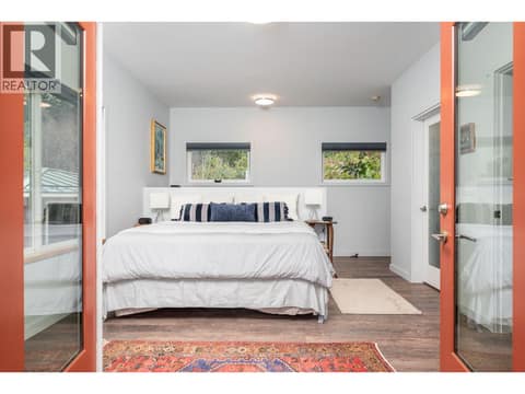 Deck access from primary at 7936 McLennan Road, North BX, Vernon