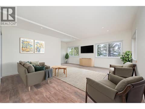 DIGITALLY ALTERED to show furnished rec room at 7936 McLennan Road, North BX, Vernon