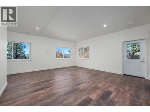 Downstairs rec room at 7936 McLennan Road, North BX, Vernon