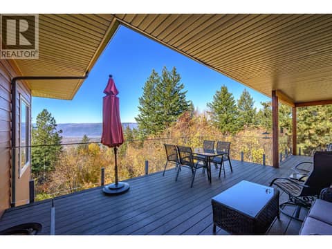Massive deck from living room and primary at 7936 McLennan Road, North BX, Vernon