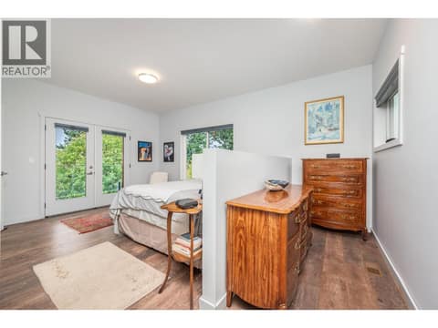 Primary bed to right of foyer as you enter on main floor - check! at 7936 McLennan Road, North BX, Vernon