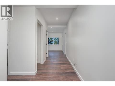 Wide hallway downstairs at 7936 McLennan Road, North BX, Vernon
