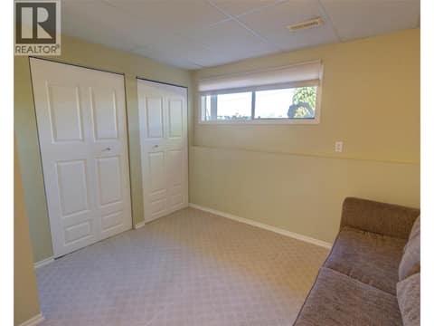Bedroom on lower level at 5894 Dedecker West Road, North BX, Vernon