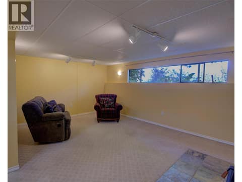 Family room in basement level at 5894 Dedecker West Road, North BX, Vernon