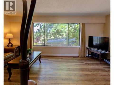 View from dining room to living room at 5894 Dedecker West Road, North BX, Vernon