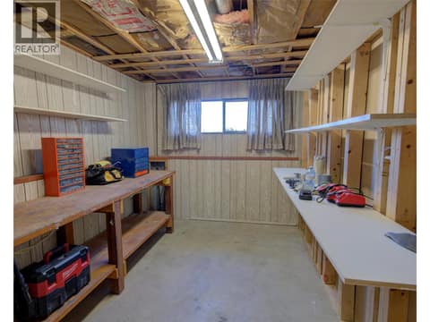 Workshop area on lower level could be coverted to 2nd bedroom on this level at 5894 Dedecker West Road, North BX, Vernon