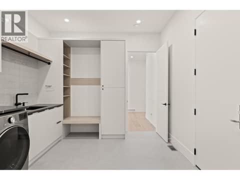 Heated tile floors in laundry at 5584 Upper Mission Court, Kettle Valley, Kelowna