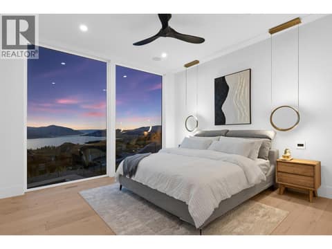 Huge windows in your primary bedroom at 5584 Upper Mission Court, Kettle Valley, Kelowna