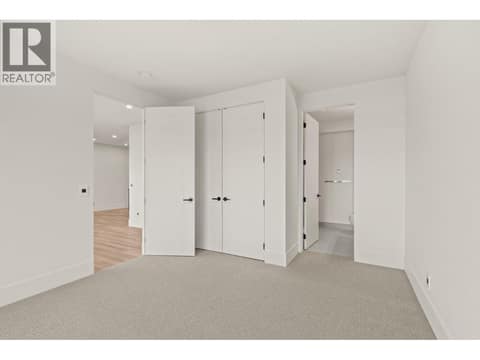 Lower bedroom with attached bathroom at 5584 Upper Mission Court, Kettle Valley, Kelowna