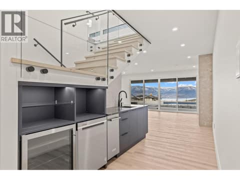 Lower wet bar with fridge, ice maker and dishwasher at 5584 Upper Mission Court, Kettle Valley, Kelowna