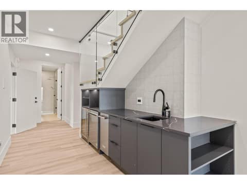 Lower wet bar with fridge, ice maker and dishwasher at 5584 Upper Mission Court, Kettle Valley, Kelowna