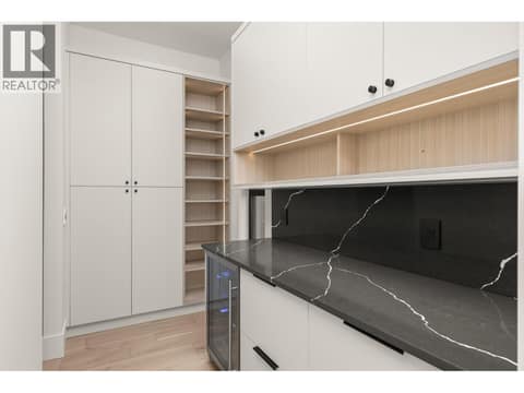 Walkthrough pantry to laundry room at 5584 Upper Mission Court, Kettle Valley, Kelowna