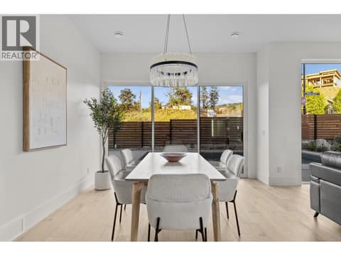 Bright dining room opening directly to swimming pool at 4983 Bucktail Lane, Upper Mission, Kelowna