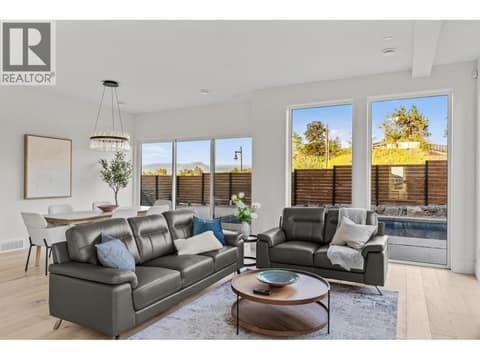 Bright living room opening directly to swimming pool at 4983 Bucktail Lane, Upper Mission, Kelowna