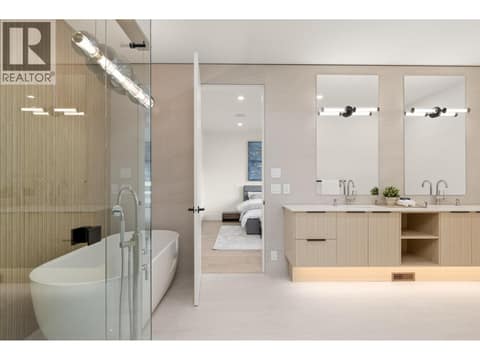 Ensuite with steam shower and soaker tub at 4983 Bucktail Lane, Upper Mission, Kelowna