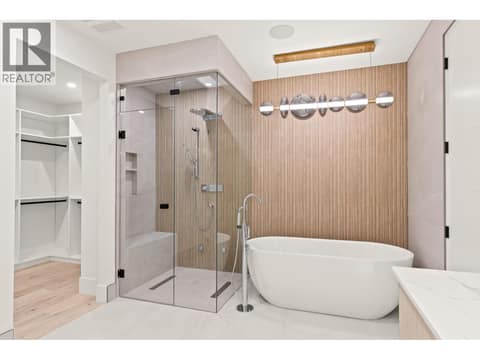 Ensuite with steam shower and soaker tub at 4983 Bucktail Lane, Upper Mission, Kelowna