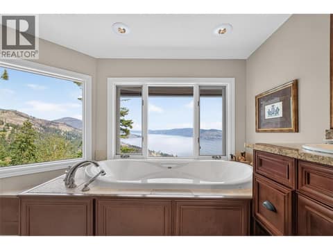 Beautiful soaker tub with incredible views at 1776 Keloka Drive, West Kelowna Estates
